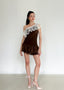 The Canelé Carame Mini Dress in Chocolate Plum