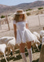 The Knit Backless Puff Dress in White
